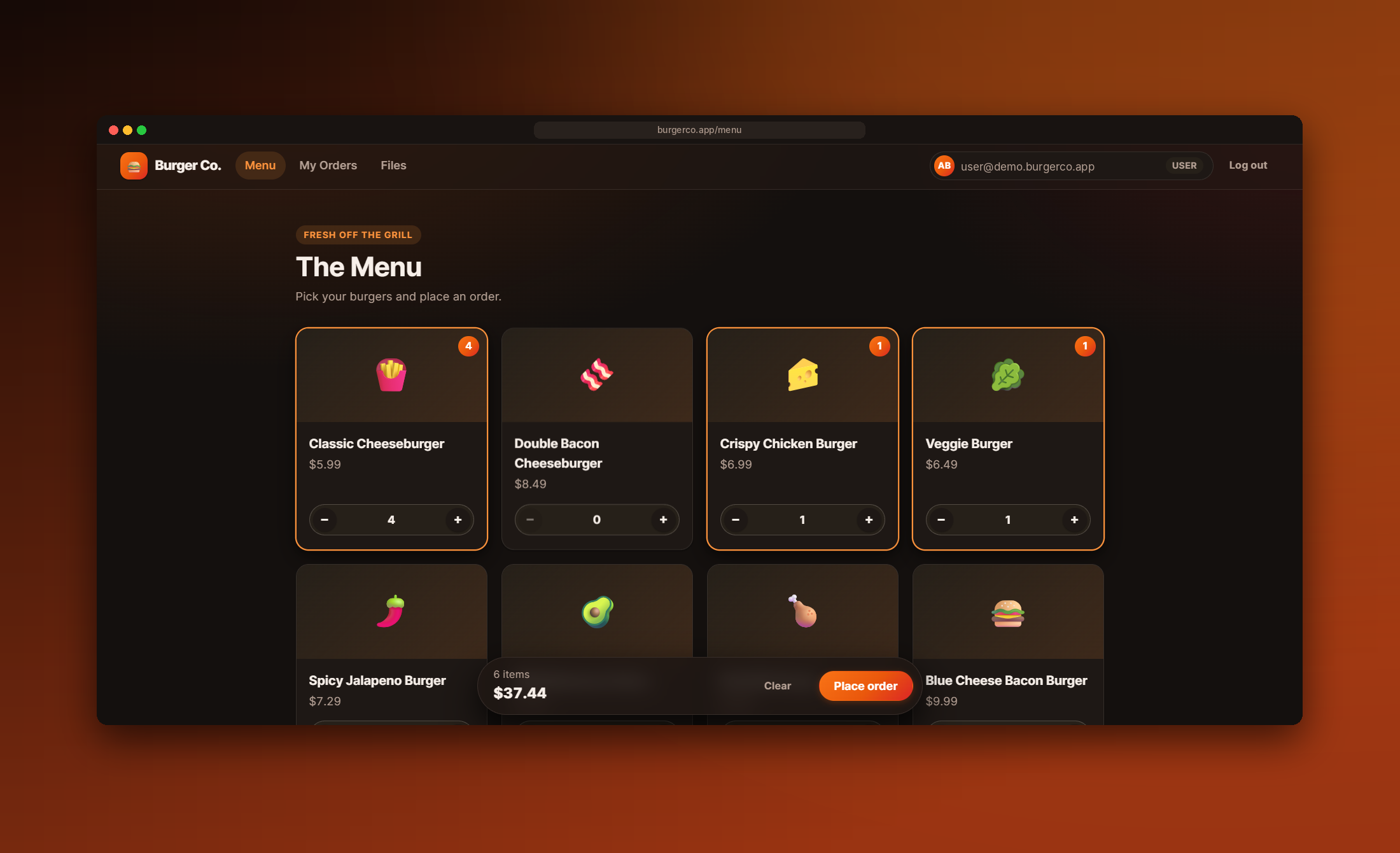 Menu of burger cards with quantity pickers and a running order total